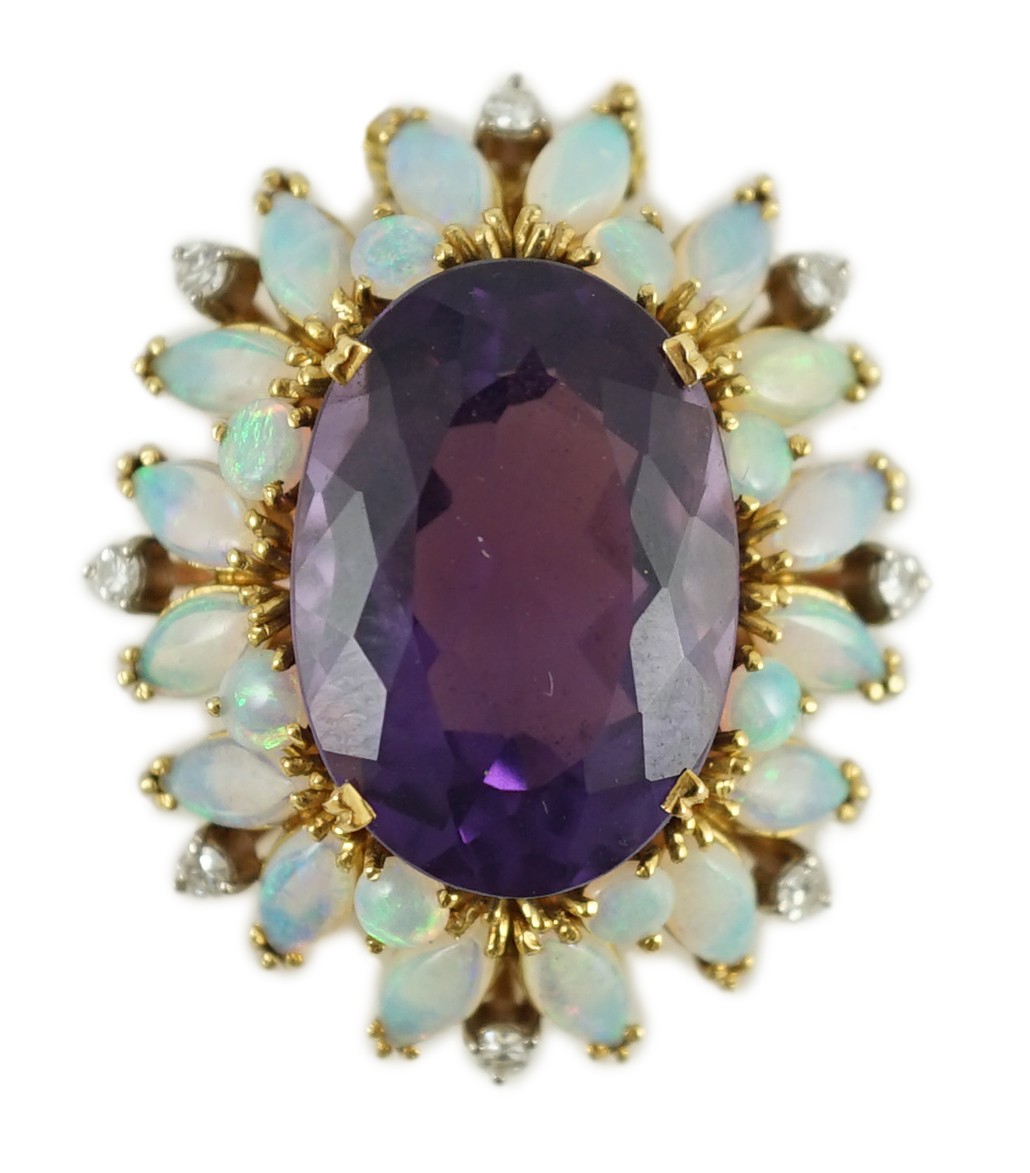 A modern 18ct gold and oval cut amethyst set pendant, with round and marquise cut white opal and round cut diamond set border, on an 18ct gold fine link chain